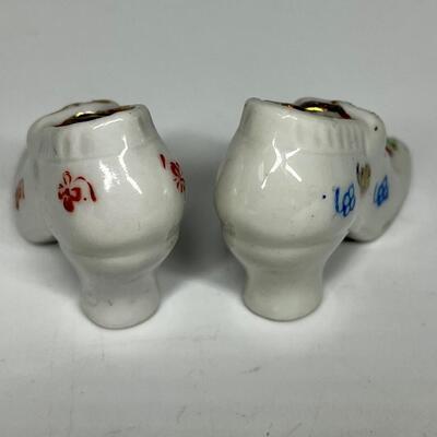 Pair of white flower pattern ceramic shoe figurines