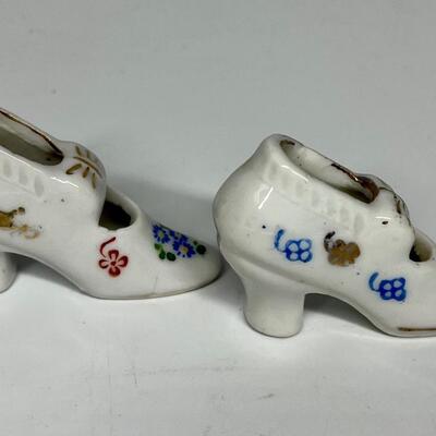Pair of white flower pattern ceramic shoe figurines