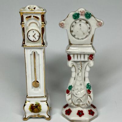Pair of white with flower pattern grandfather clocks ceramic figurines