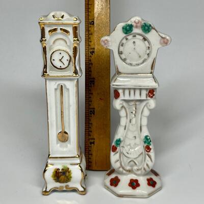 Pair of white with flower pattern grandfather clocks ceramic figurines