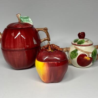 Lot of three apple themed tea pot and sugar bowls