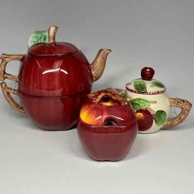 Lot of three apple themed tea pot and sugar bowls
