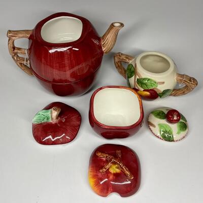 Lot of three apple themed tea pot and sugar bowls