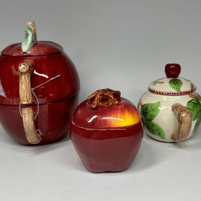 Lot of three apple themed tea pot and sugar bowls