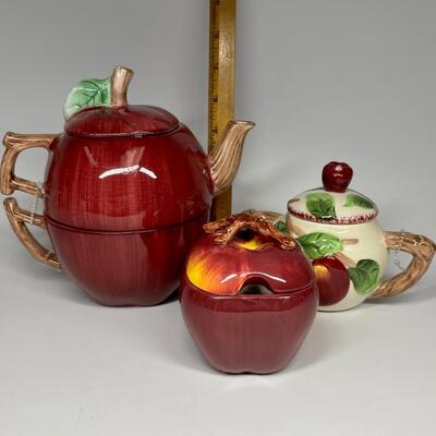 Lot of three apple themed tea pot and sugar bowls