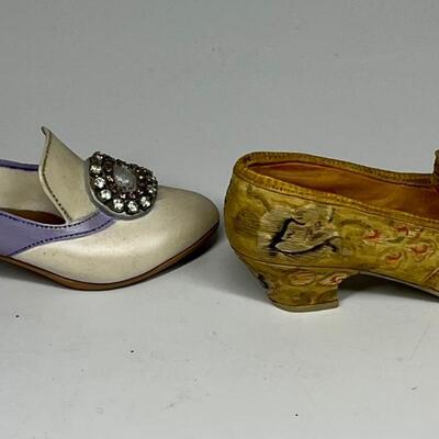 Pair of miniature white purple and gold shoe figurines