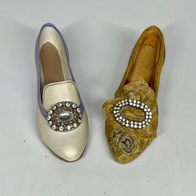 Pair of miniature white purple and gold shoe figurines