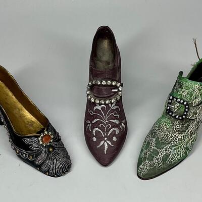 Lot of three miniature purple green and blue shoe figurines