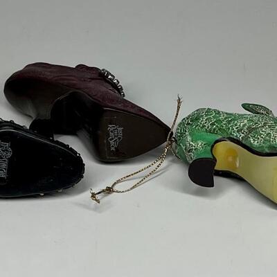 Lot of three miniature purple green and blue shoe figurines