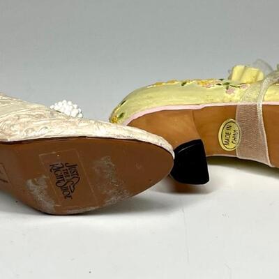 Lot of two white and yellow miniature shoe figurines