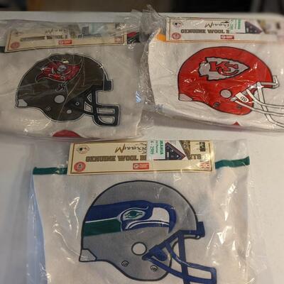 Total of 47 NOS NFL Pennants from the Rams, 49ers, Titans, Saints, Raiders, Bears, Cowboys, Chargers, Bengals, Jets, etc