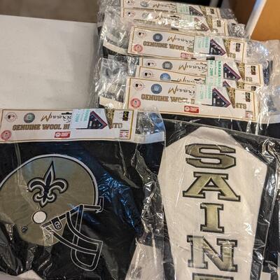 Total of 47 NOS NFL Pennants from the Rams, 49ers, Titans, Saints, Raiders, Bears, Cowboys, Chargers, Bengals, Jets, etc