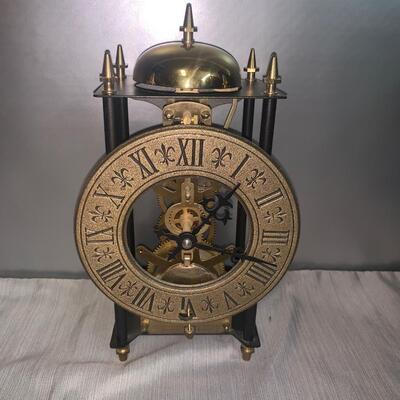 Vintage Roman numerals swaying clock