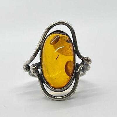 LOT 65: Sterling Silver and Amber Ring - Size 10