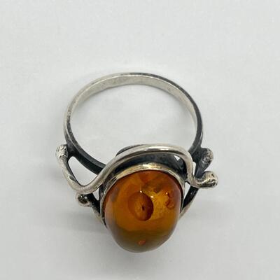 LOT 65: Sterling Silver and Amber Ring - Size 10