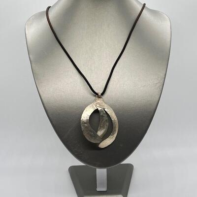 LOT 71: Handcrafted Hammered Silver Pendant on 20" Cord Necklace
