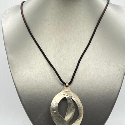 LOT 71: Handcrafted Hammered Silver Pendant on 20" Cord Necklace