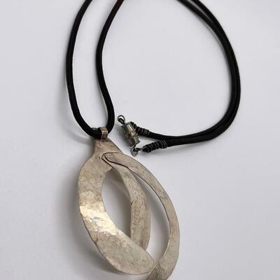 LOT 71: Handcrafted Hammered Silver Pendant on 20" Cord Necklace