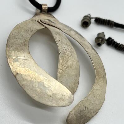 LOT 71: Handcrafted Hammered Silver Pendant on 20" Cord Necklace
