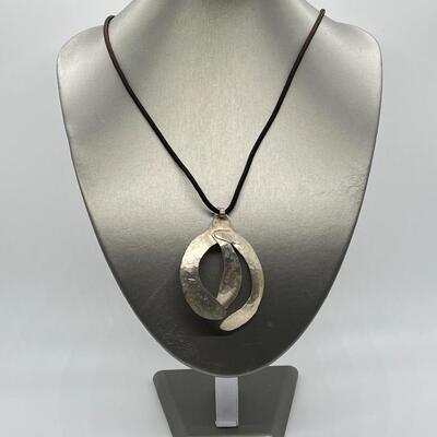 LOT 71: Handcrafted Hammered Silver Pendant on 20" Cord Necklace