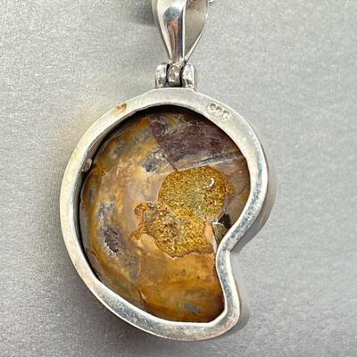 LOT 74: Sterling Silver & Possibly Raw Gemstone Pendant on 20