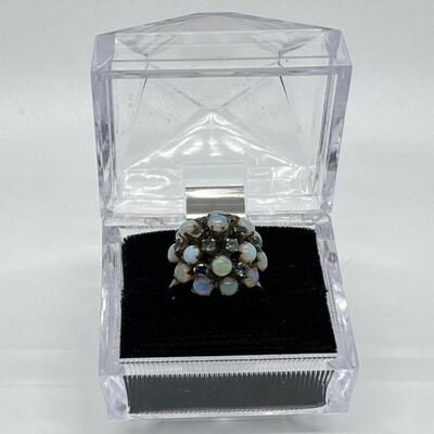 LOT 80: 10k gold Opal & Blue Topaz Size 7 Cluster Ring 4.2 grams total weight - missing one opal