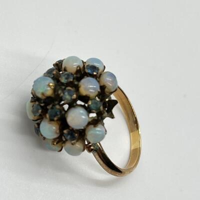 LOT 80: 10k gold Opal & Blue Topaz Size 7 Cluster Ring 4.2 grams total weight - missing one opal