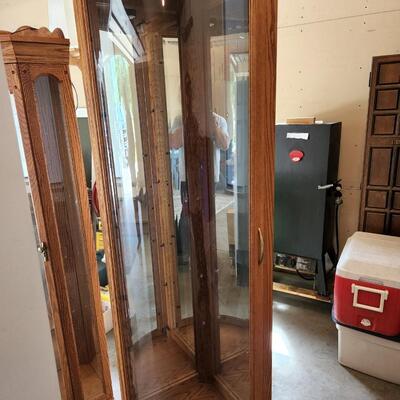 Tall rounded glass corner curio cabinet