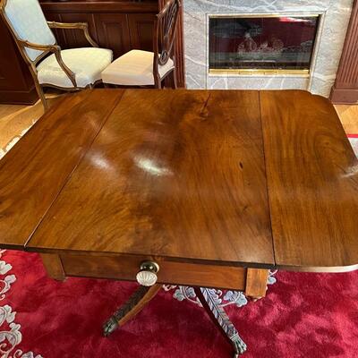 Elegant Antique Expandable Wood Table with Metal Claw Feet
