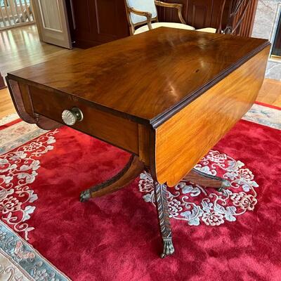 Elegant Antique Expandable Wood Table with Metal Claw Feet
