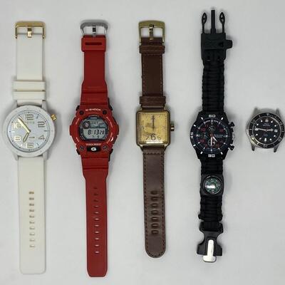 Assortment of Watches Including Area 51 Toxic, Casio G-Shock, Oui Art, Seven Core Paracord, and Swiss Military Watch Face