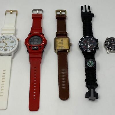 Assortment of Watches Including Area 51 Toxic, Casio G-Shock, Oui Art, Seven Core Paracord, and Swiss Military Watch Face