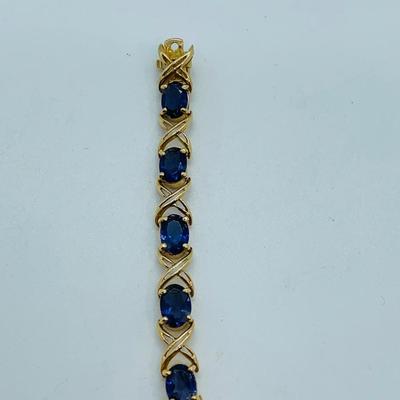 LOT 58: Tanzanite Gemstone 14K Gold Tennis Bracelet - 7.5" 9.9 gtw