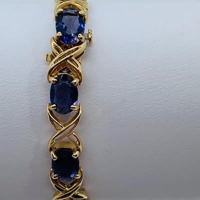 LOT 58: Tanzanite Gemstone 14K Gold Tennis Bracelet - 7.5" 9.9 gtw