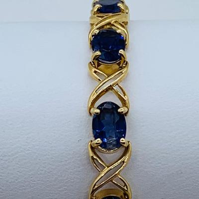 LOT 58: Tanzanite Gemstone 14K Gold Tennis Bracelet - 7.5" 9.9 gtw