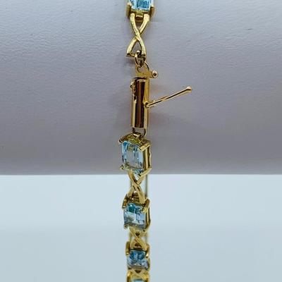 LOT 59: Blue Gemstone Emerald Cut 14K Gold 7.5" Tennis Bracelet - 6.93 gtw