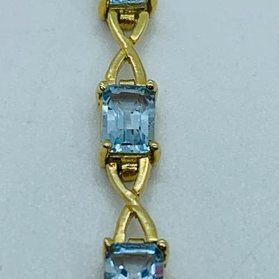 LOT 59: Blue Gemstone Emerald Cut 14K Gold 7.5" Tennis Bracelet - 6.93 gtw