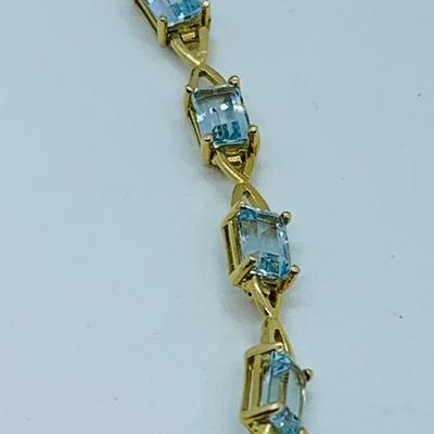 LOT 59: Blue Gemstone Emerald Cut 14K Gold 7.5" Tennis Bracelet - 6.93 gtw