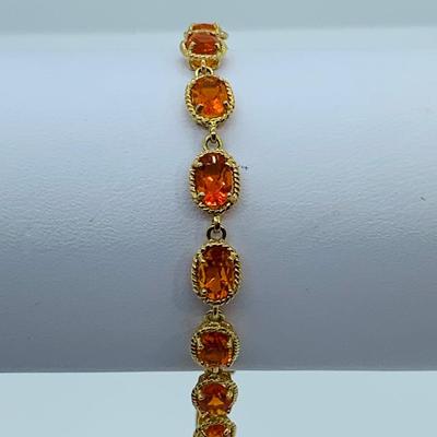LOT 60: Padparadscha Sapphire 14K Gold 7.5" Tennis Bracelet - 6.2 gtw (One Stone Different than the Rest)