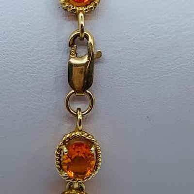 LOT 60: Padparadscha Sapphire 14K Gold 7.5" Tennis Bracelet - 6.2 gtw (One Stone Different than the Rest)