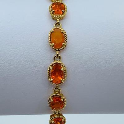 LOT 60: Padparadscha Sapphire 14K Gold 7.5" Tennis Bracelet - 6.2 gtw (One Stone Different than the Rest)
