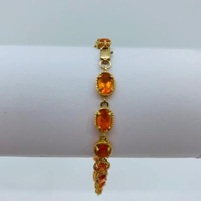 LOT 60: Padparadscha Sapphire 14K Gold 7.5" Tennis Bracelet - 6.2 gtw (One Stone Different than the Rest)