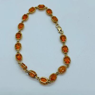 LOT 60: Padparadscha Sapphire 14K Gold 7.5" Tennis Bracelet - 6.2 gtw (One Stone Different than the Rest)