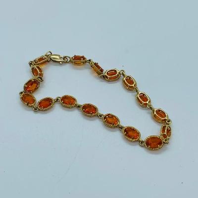 LOT 60: Padparadscha Sapphire 14K Gold 7.5" Tennis Bracelet - 6.2 gtw (One Stone Different than the Rest)