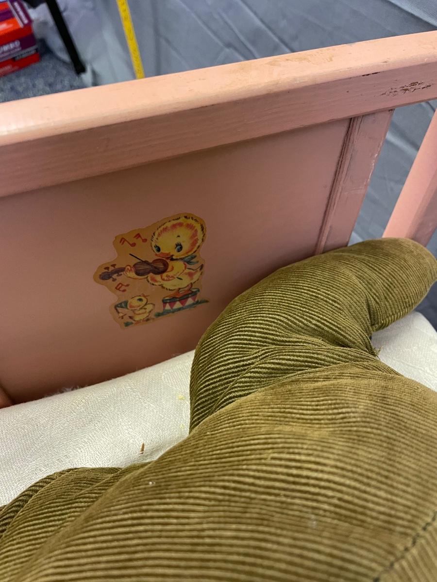 Adorable vintage baby bed and guests