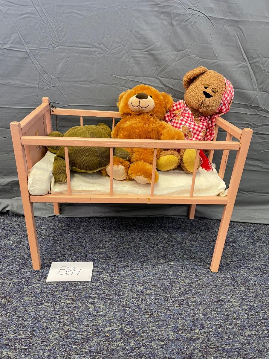 Adorable vintage baby bed and guests