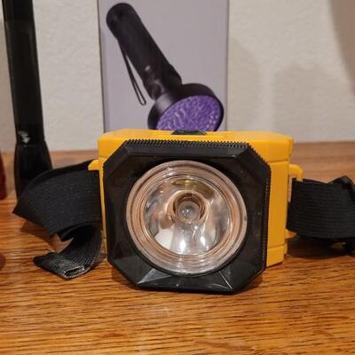 Lot 136: Head and Handheld Flashlights includes New in Box Scorpion UV Flashlight