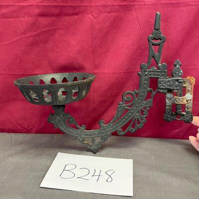 Cast iron, swing arm, oil/candle lamp holder