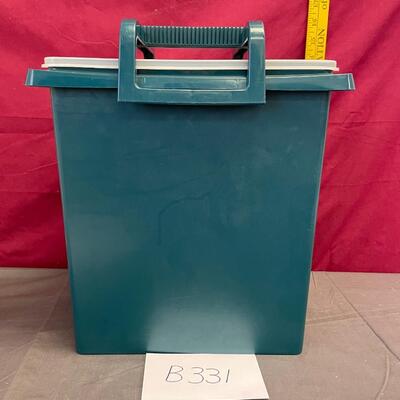 Teal plastic Tupperware garbage can