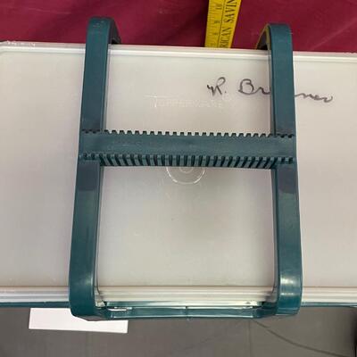 Teal plastic Tupperware garbage can